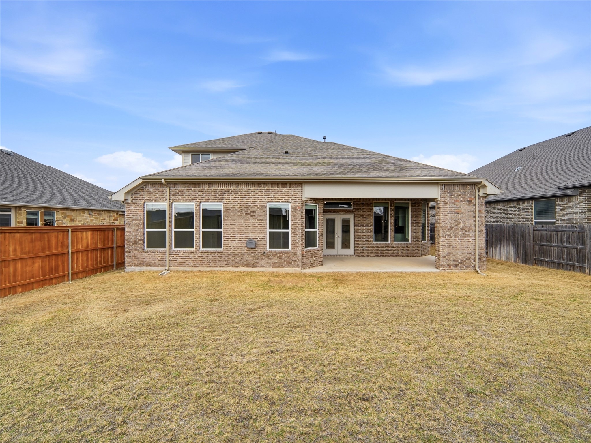 848 Wild Pecan Loop Buda, TX 78610 - Photo 27 of 49 Expansive backyard with an efficient built-in sprinkler system.