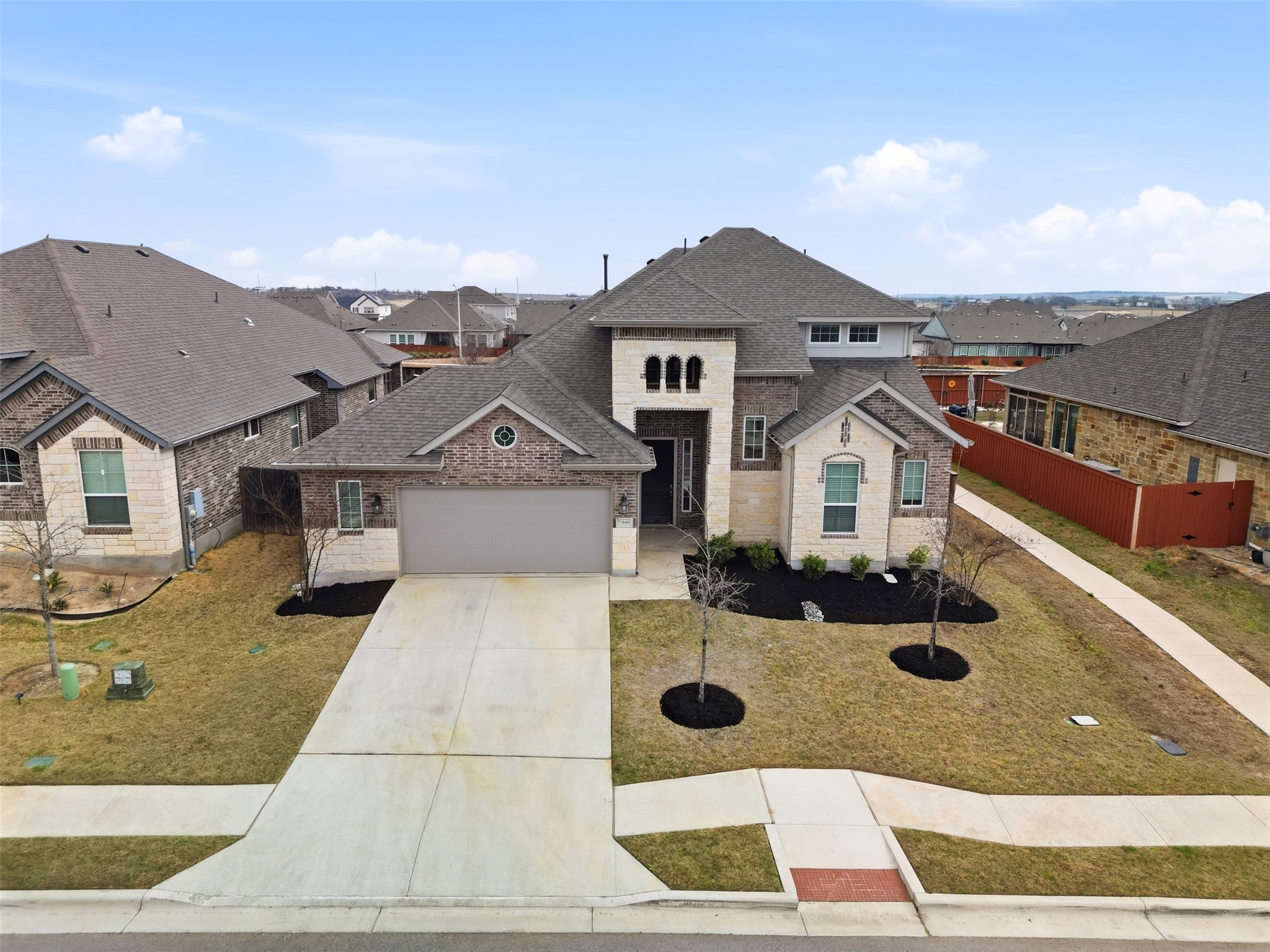 848 Wild Pecan Loop Buda, TX 78610 - Photo 29 of 49 This home features built-in sprinklers, efficient gutters, and direct access to a scenic walking path.