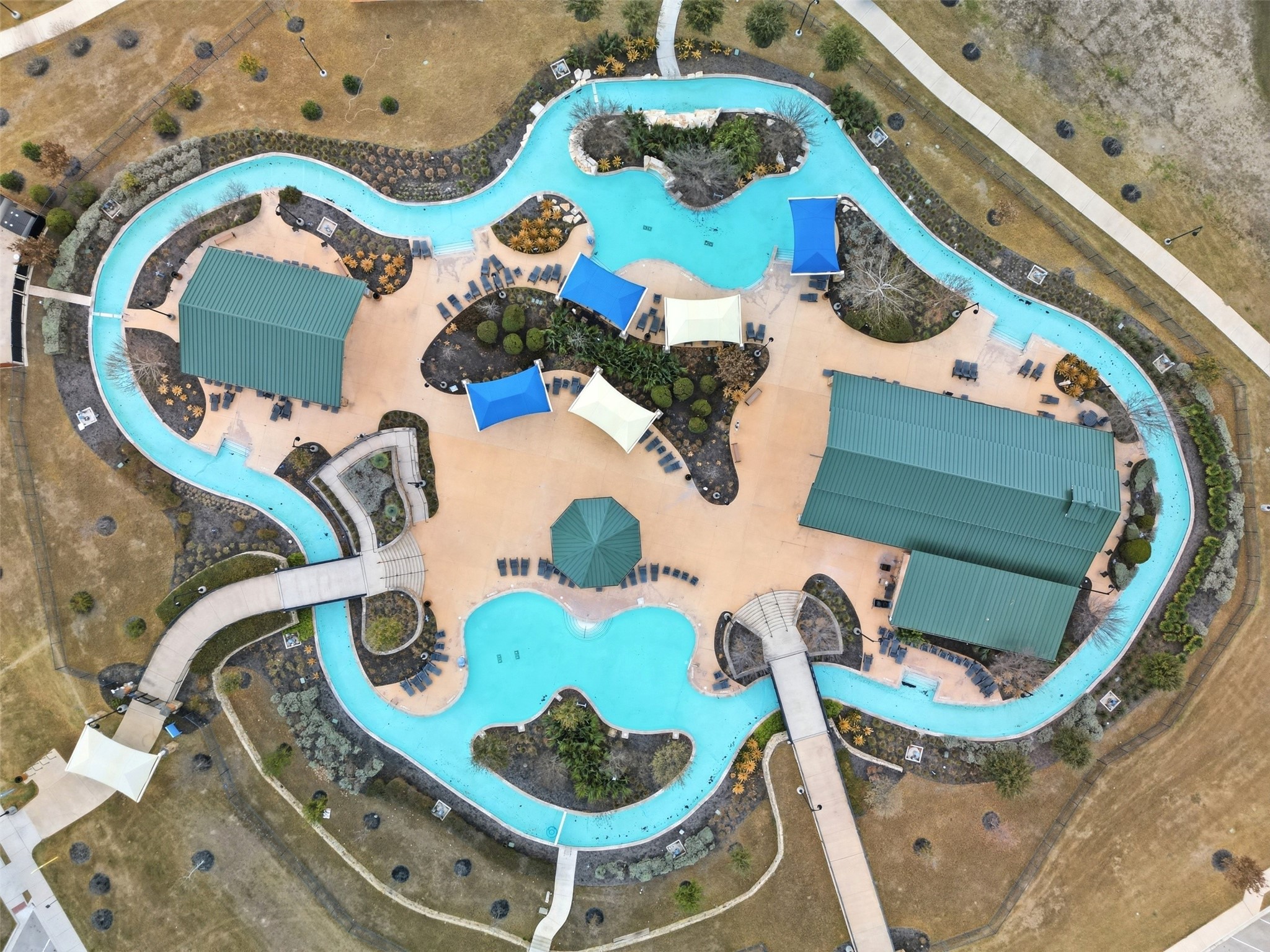 848 Wild Pecan Loop Buda, TX 78610 - Photo 3 of 49 Experience ultimate relaxation with access to a serene lazy river, one of three stunning community pools.