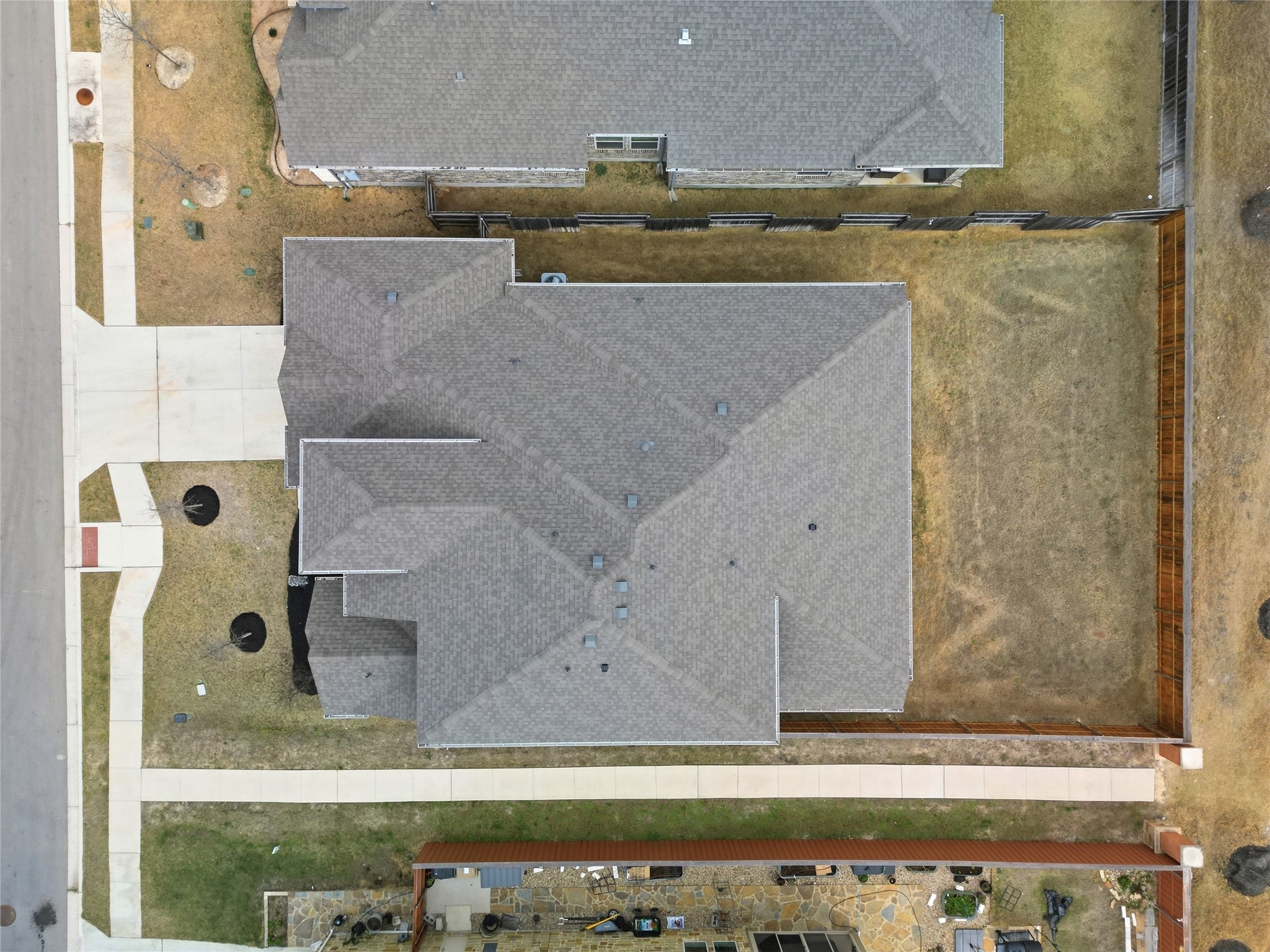 848 Wild Pecan Loop Buda, TX 78610 - Photo 36 of 49 This home features built-in sprinklers, efficient gutters, and convenient access to a scenic walking path.