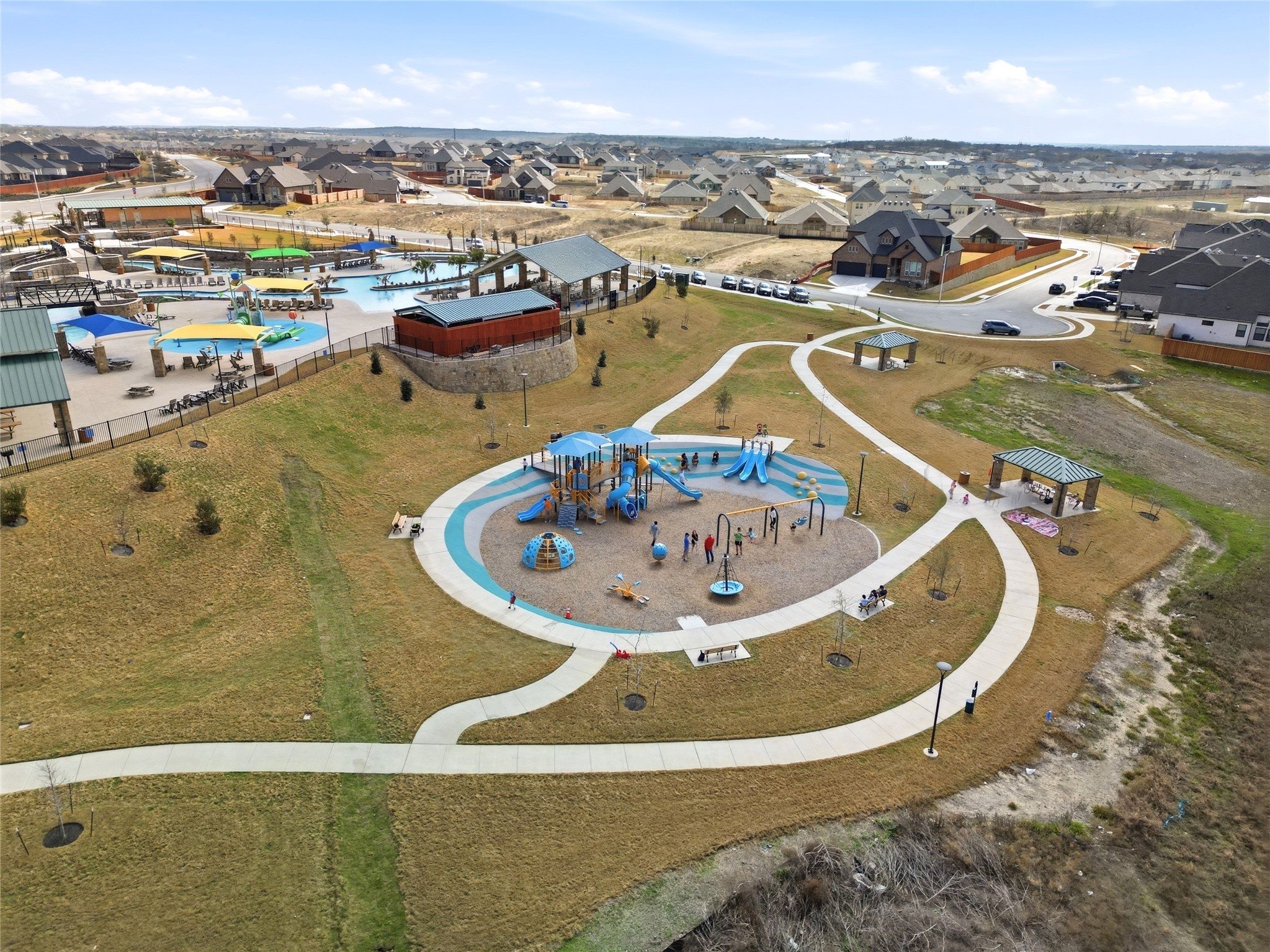 848 Wild Pecan Loop Buda, TX 78610 - Photo 39 of 49 Enjoy vibrant community living with access to a refreshing pool and scenic park.