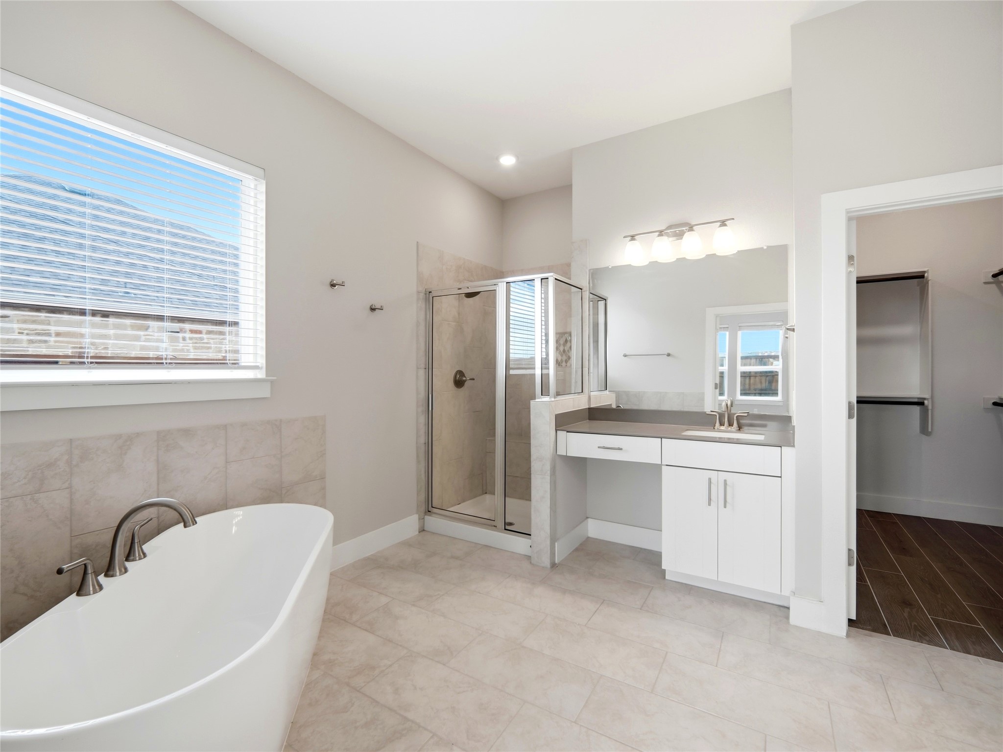 848 Wild Pecan Loop Buda, TX 78610 - Photo 40 of 49 Luxurious master bath featuring a freestanding tub for ultimate relaxation.