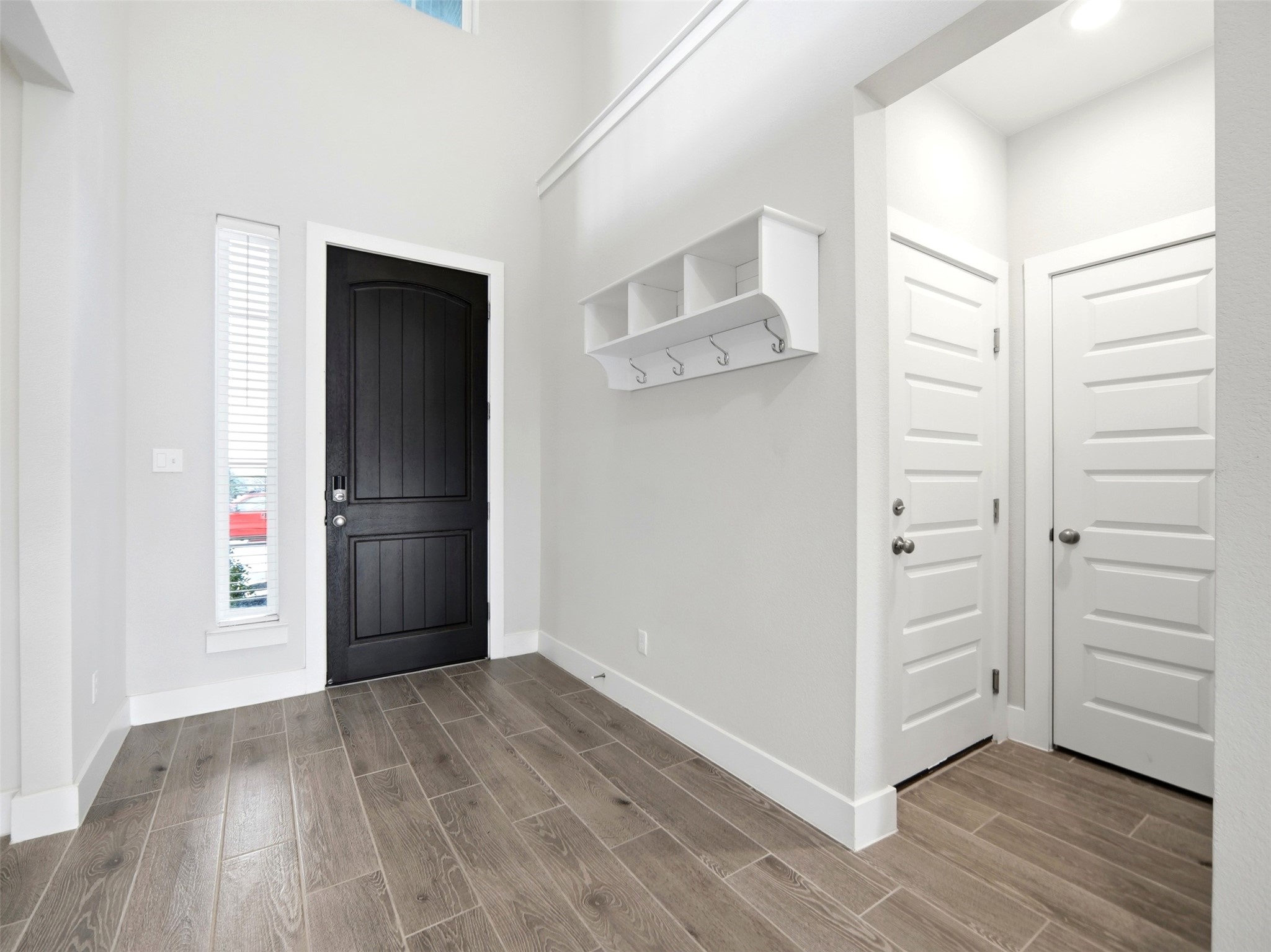 848 Wild Pecan Loop Buda, TX 78610 - Photo 42 of 49 Welcoming entryway with convenient garage access and a spacious coat closet.