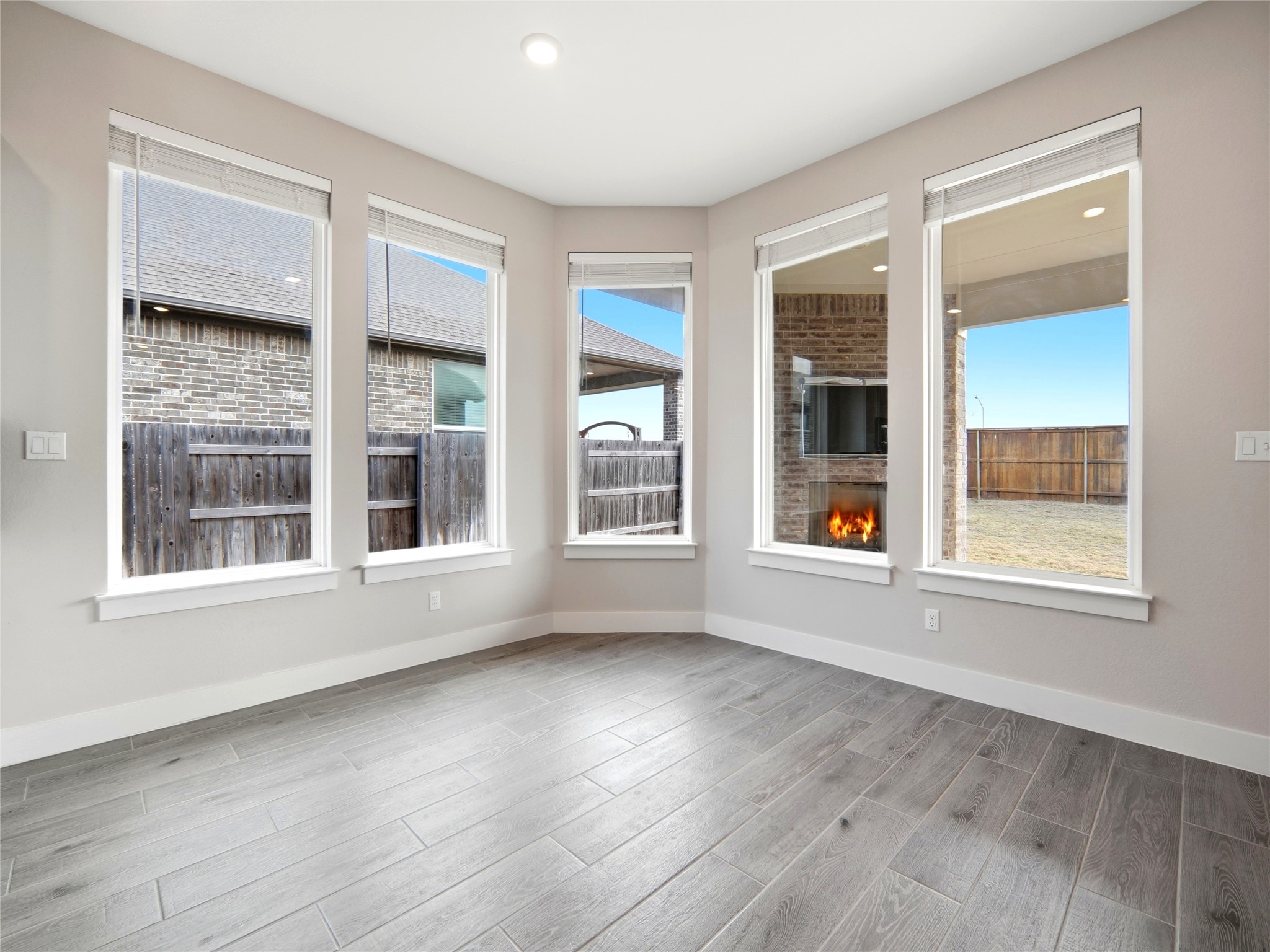 848 Wild Pecan Loop Buda, TX 78610 - Photo 43 of 49 Enjoy serene views and abundant natural light from the dining room's expansive windows.
