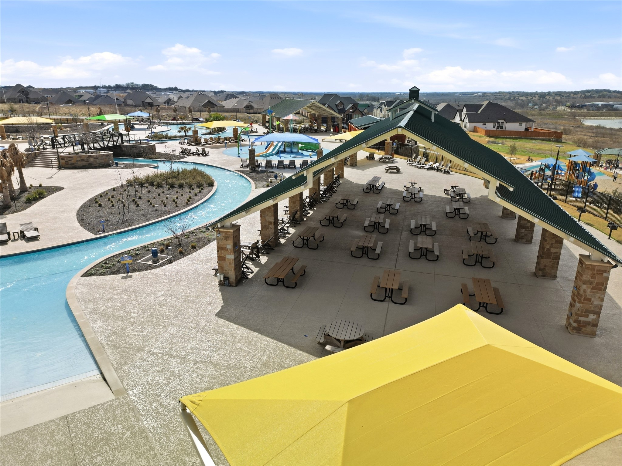 848 Wild Pecan Loop Buda, TX 78610 - Photo 44 of 49 Discover the inviting community pool, complete with a stylish shaded area for relaxation.