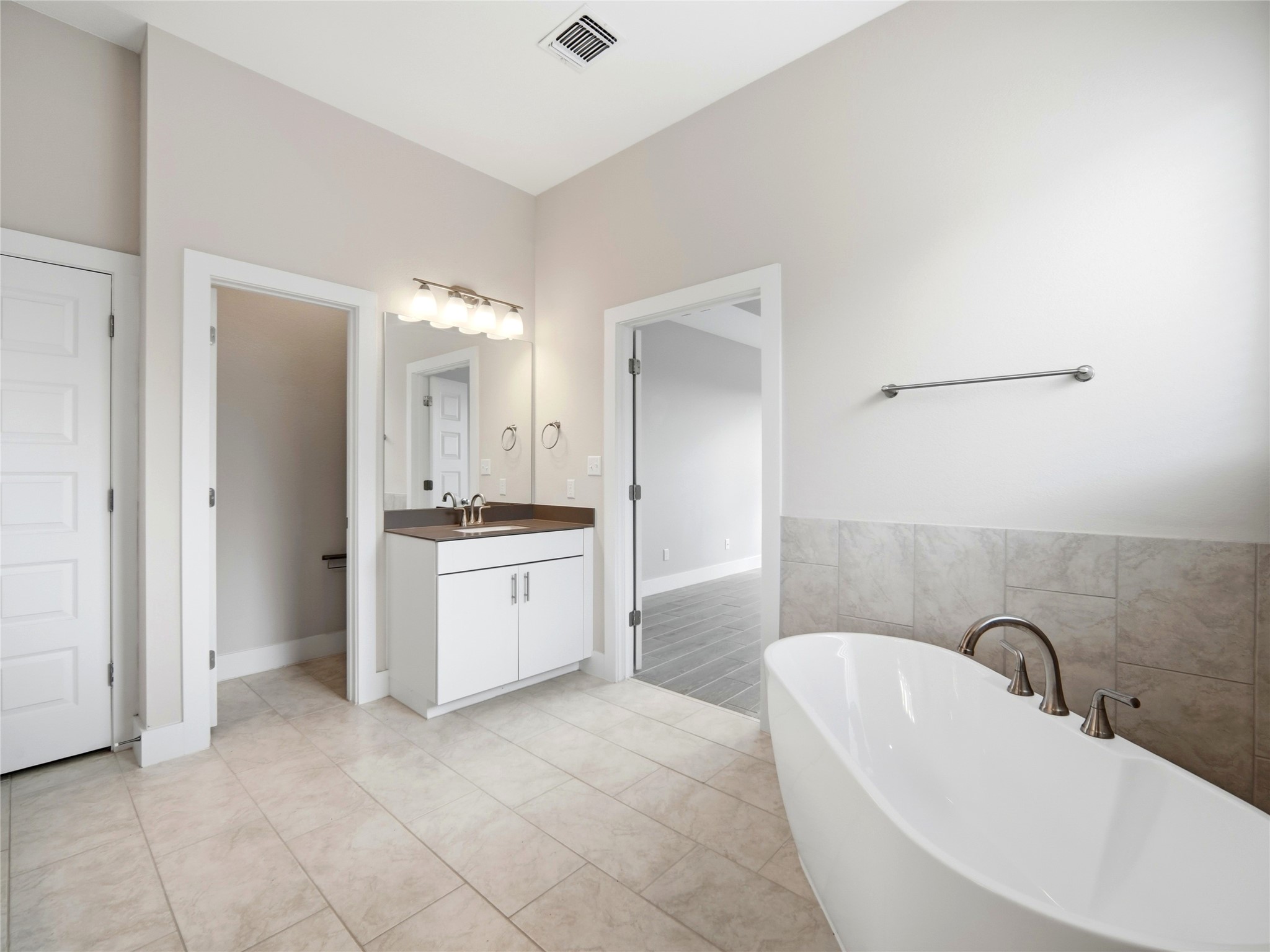 848 Wild Pecan Loop Buda, TX 78610 - Photo 9 of 49 Luxurious master bath featuring dual sinks for convenience and style.