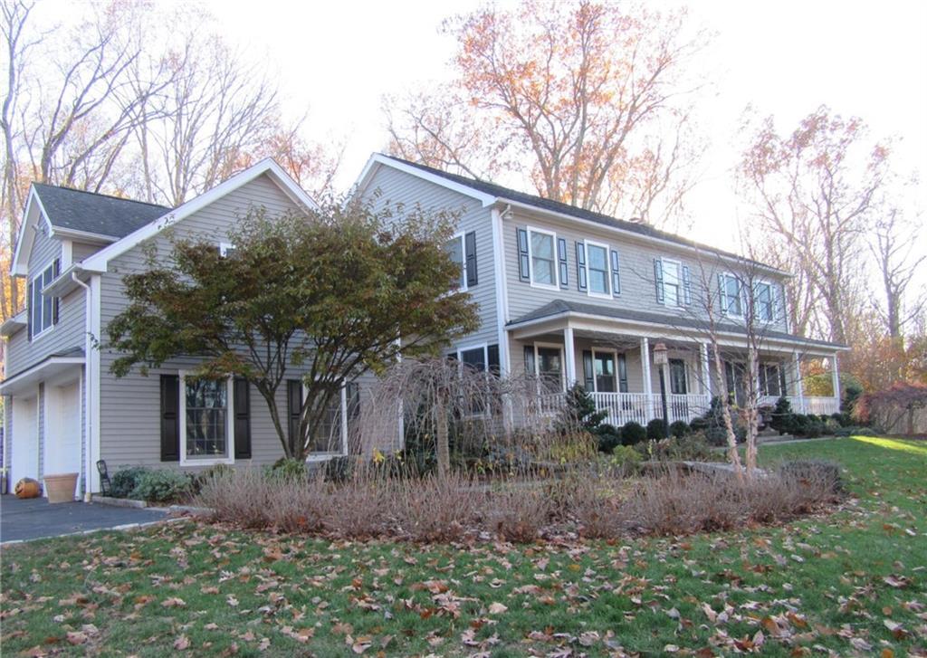 182 Pimpewaug Road Wilton, CT 06897 - Photo 1 of 1 a front view of a house with garden