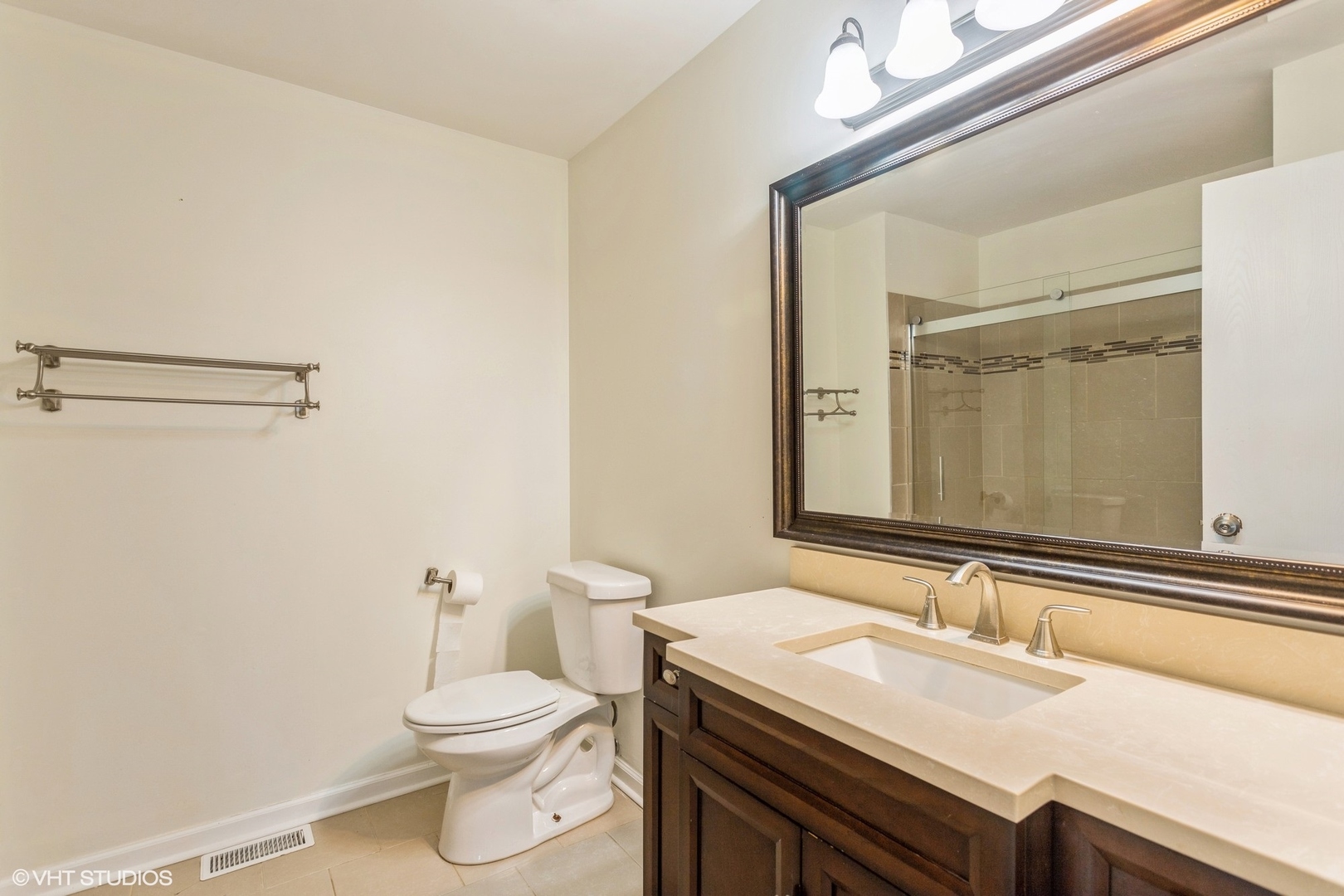 3022 Anton Drive Aurora, IL 60504 - Photo 11 of 15 a bathroom with a granite countertop sink a toilet and a mirror
