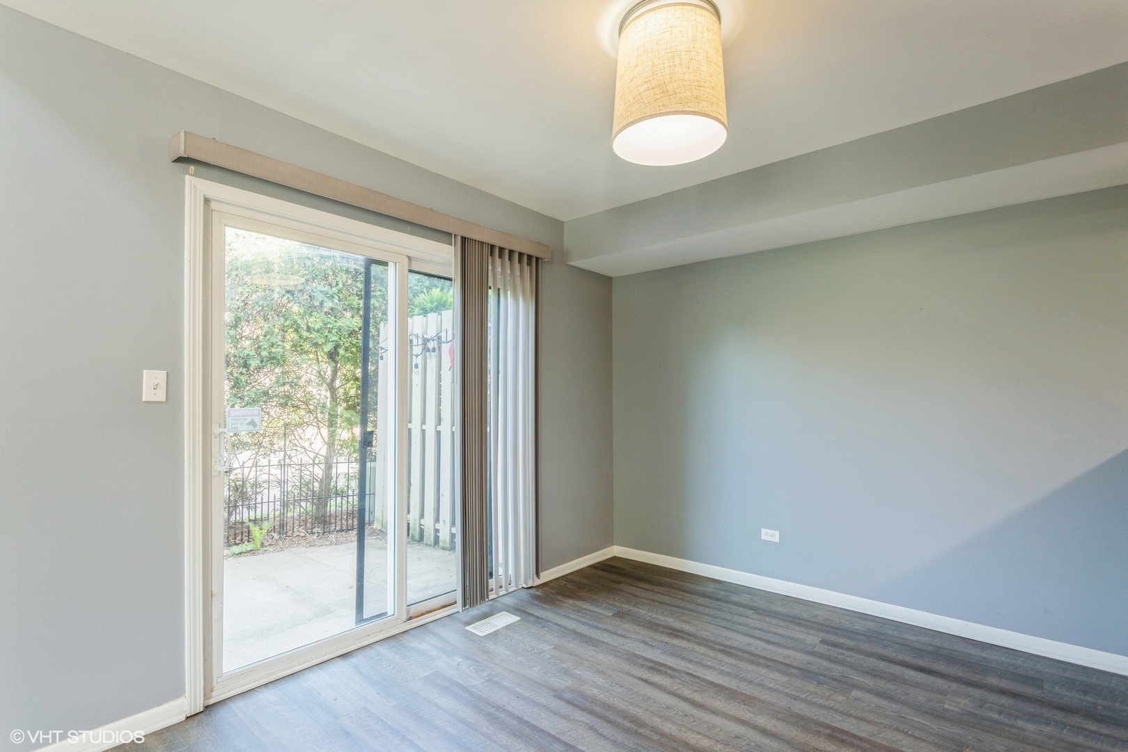 3022 Anton Drive Aurora, IL 60504 - Photo 7 of 15 a view of an empty room with wooden floor and a window