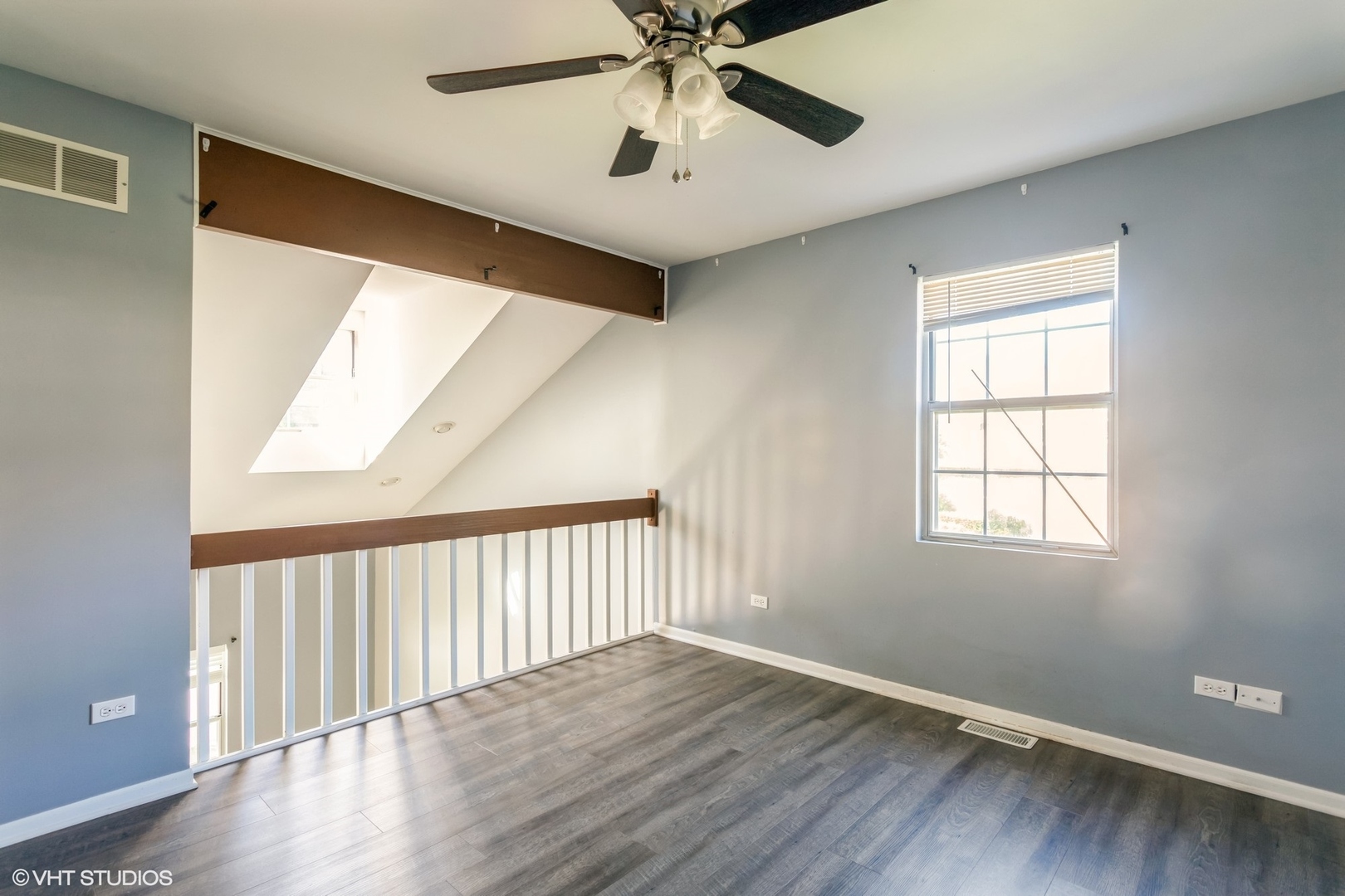3022 Anton Drive Aurora, IL 60504 - Photo 8 of 15 a view of an empty room with wooden floor and a window