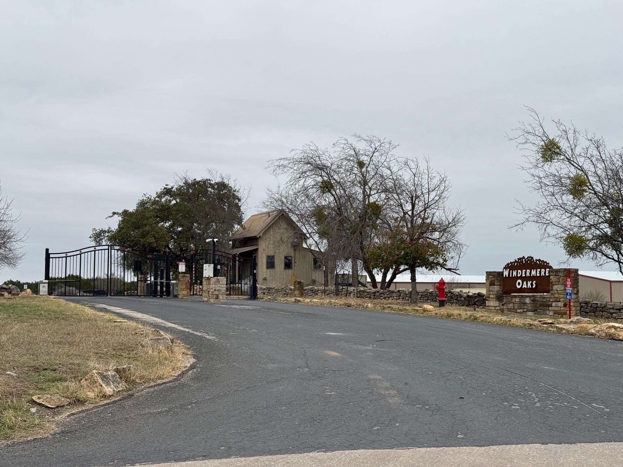 Lot 267 Coventry Road Spicewood, TX 78669 - Photo 1 of 17 a view of road with building and trees around