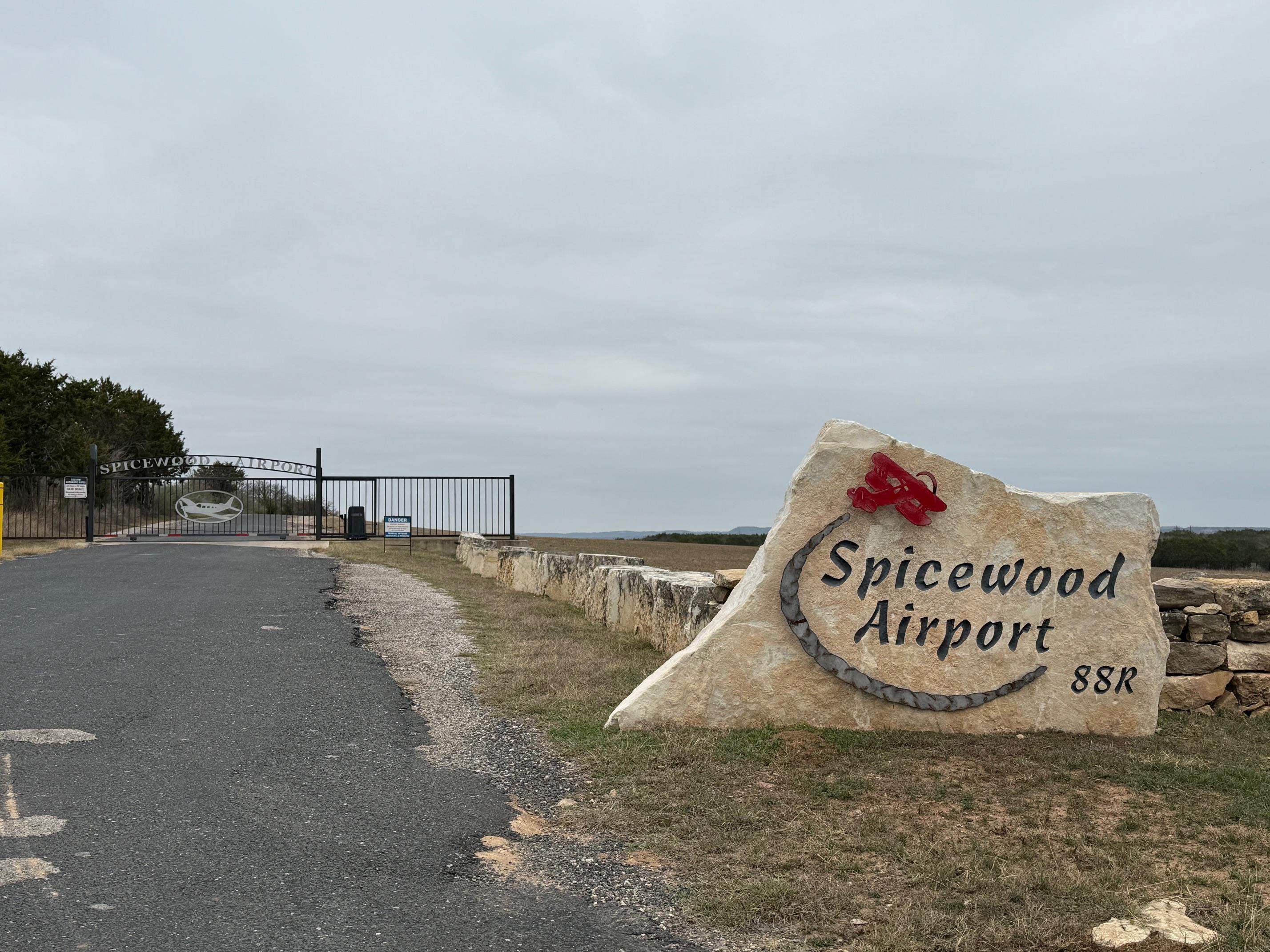 Lot 267 Coventry Road Spicewood, TX 78669 - Photo 2 of 17 a view of a street with a building in the background