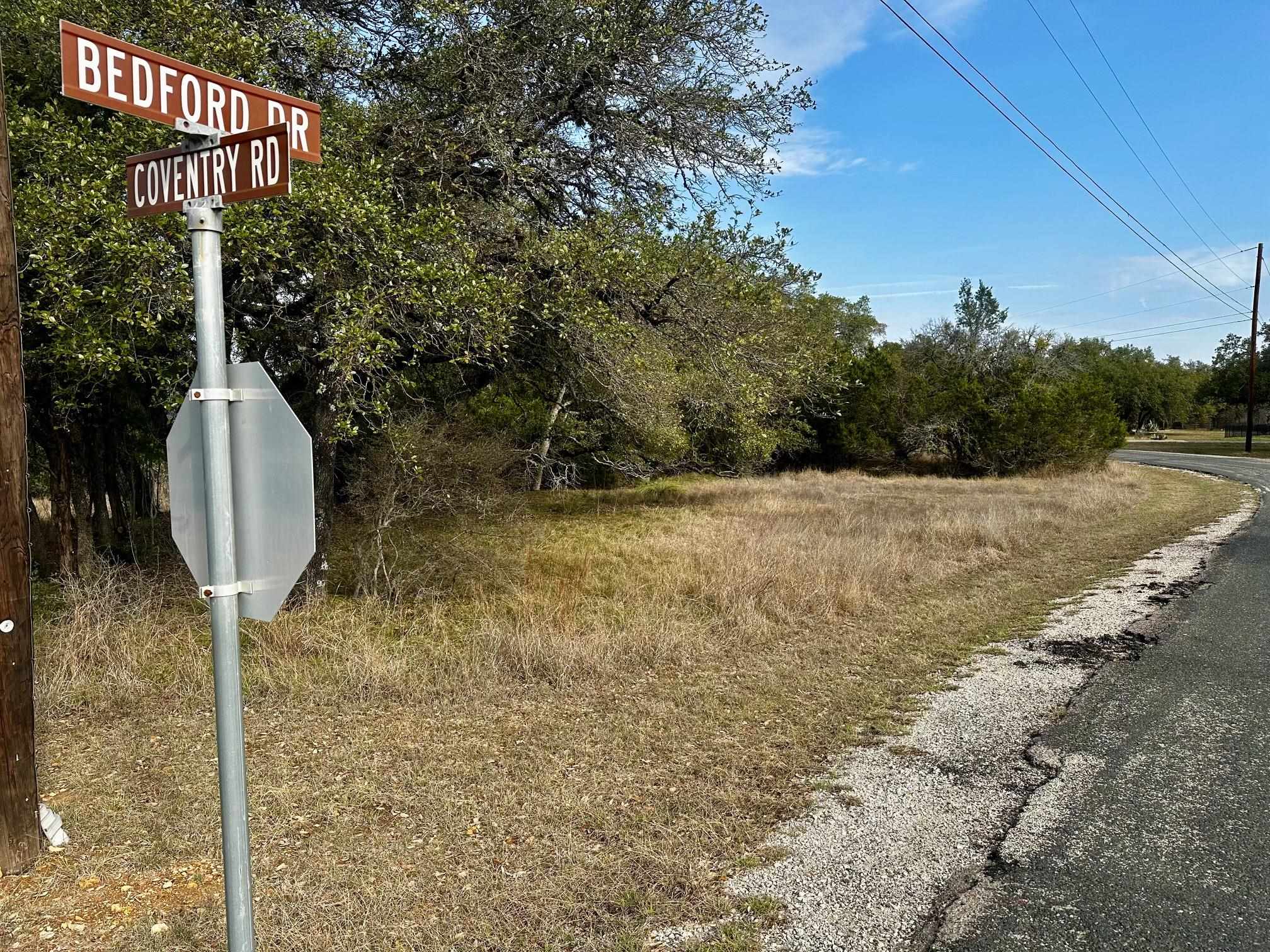 Lot 267 Coventry Road Spicewood, TX 78669 - Photo 6 of 17 a front view of a house with garden