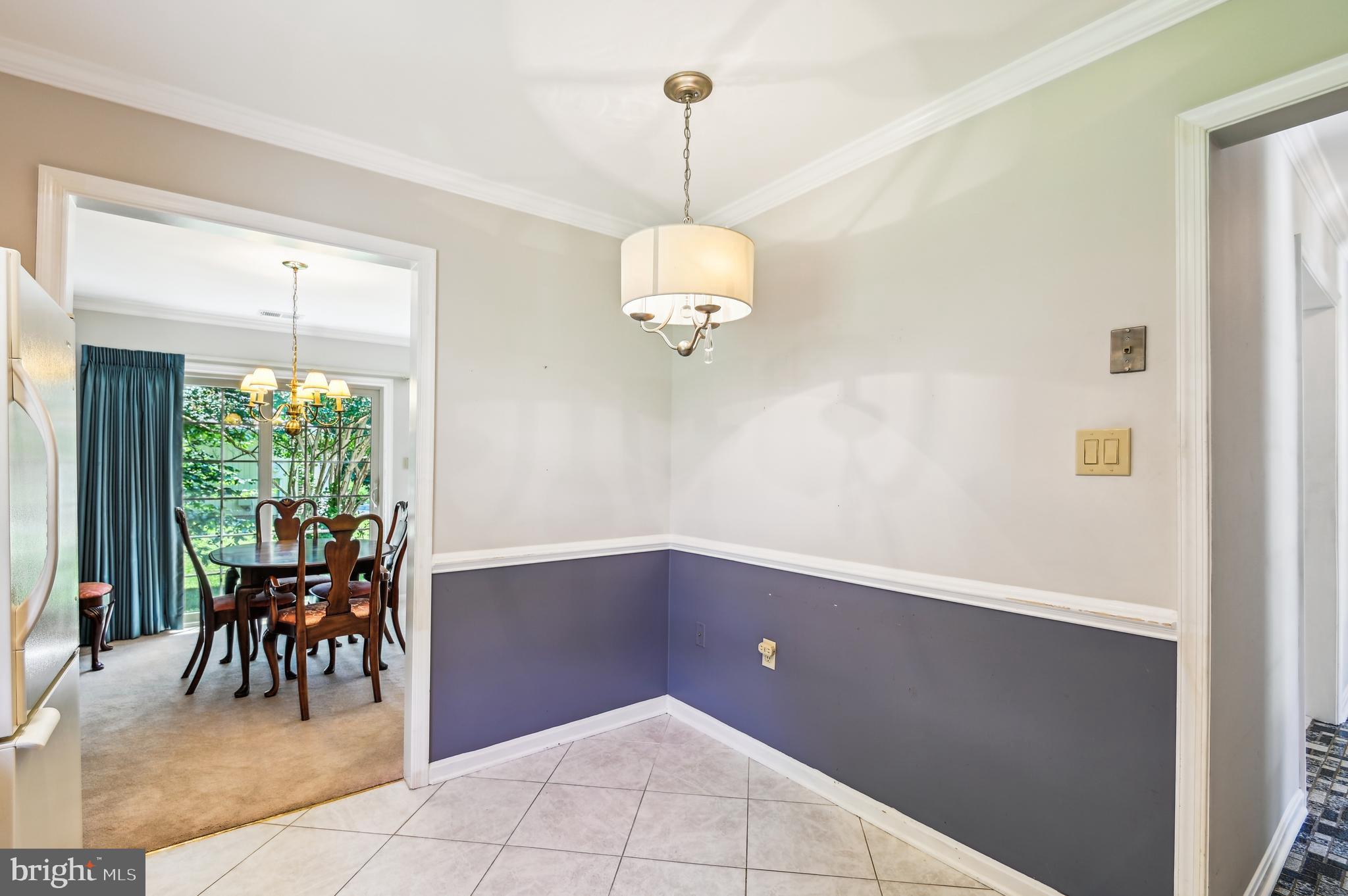 940 Schooner Circle Annapolis, MD 21401 - Photo 11 of 36 a view of a dining room with furniture window and outside view