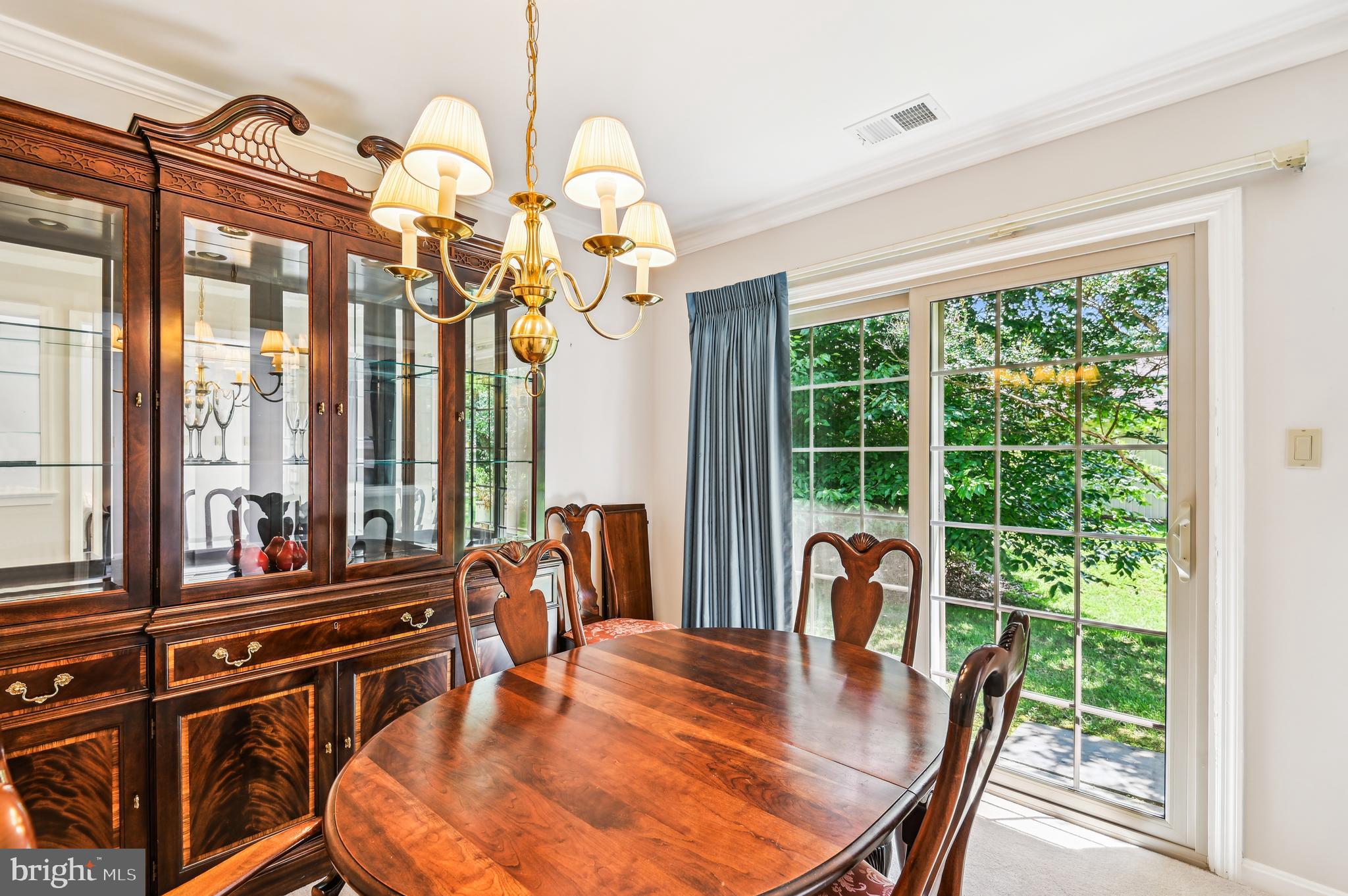 940 Schooner Circle Annapolis, MD 21401 - Photo 12 of 36 a dining room filled with furniture and large windows