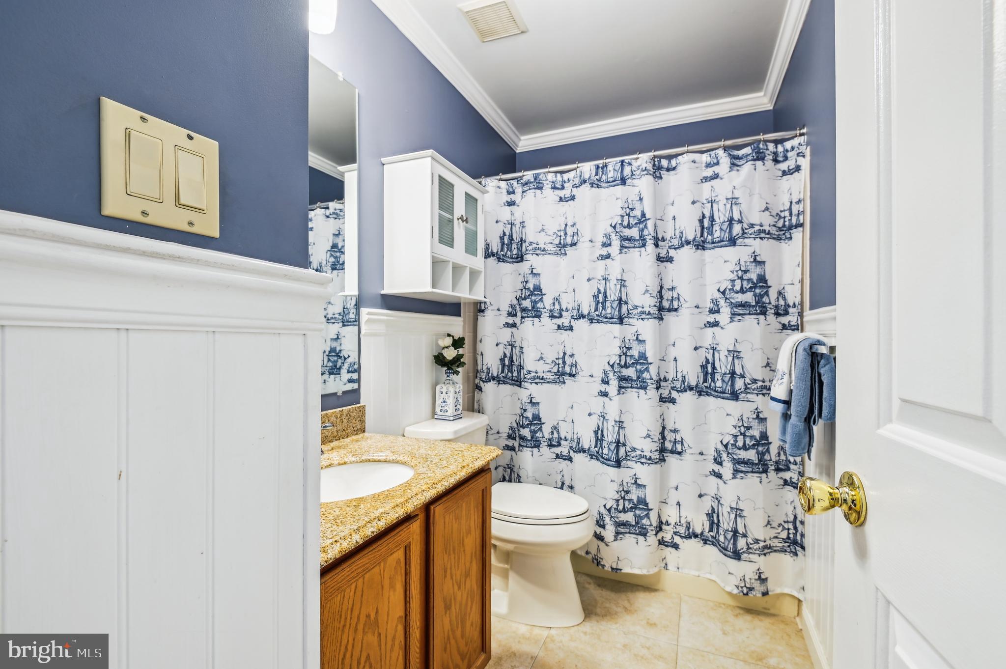 940 Schooner Circle Annapolis, MD 21401 - Photo 20 of 36 a white toilet sitting next to a bathroom sink