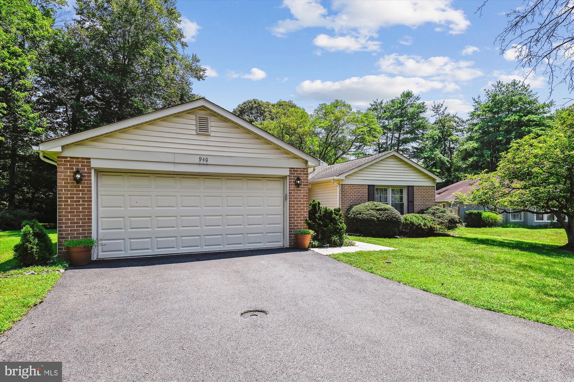 940 Schooner Circle Annapolis, MD 21401 - Photo 2 of 36 a front view of a house with a yard and garage