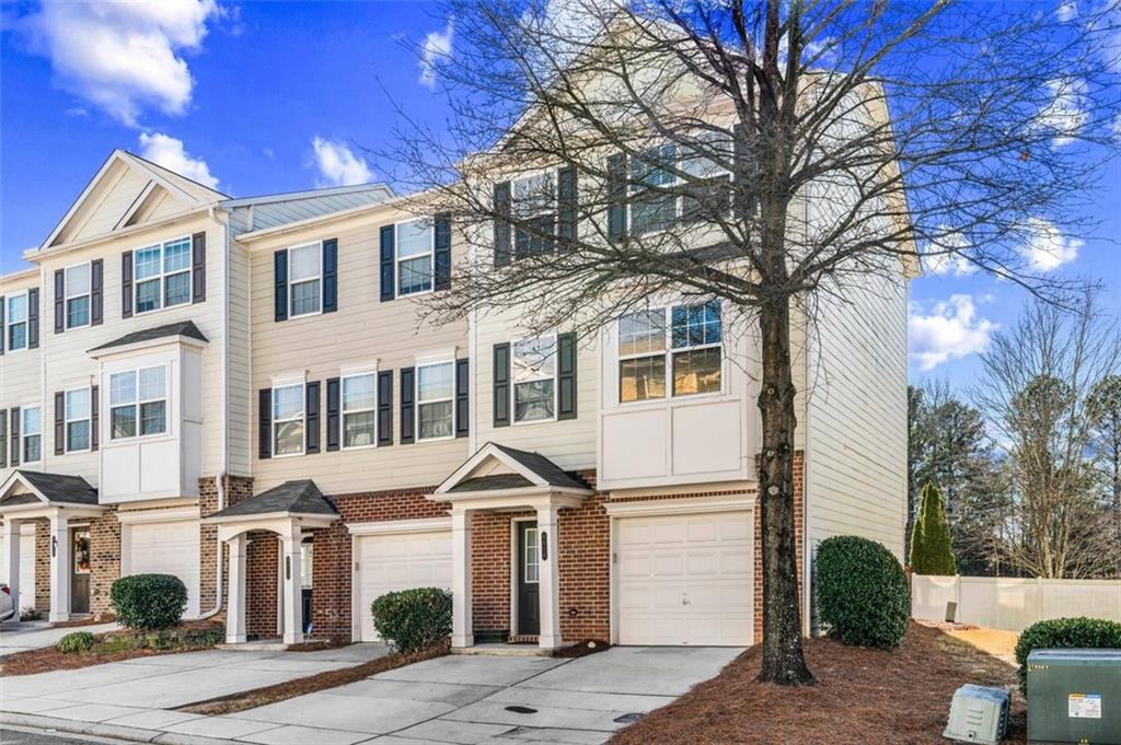 6816 Blackstone Place Mableton, GA 30126 - Photo 1 of 33 a front view of a house with a yard