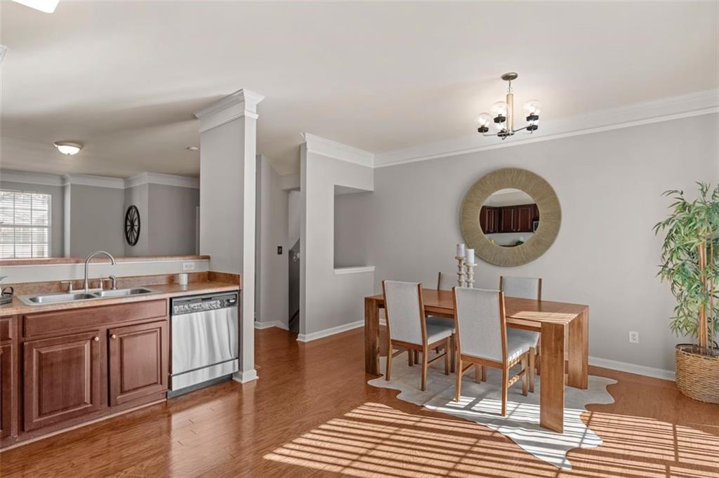 6816 Blackstone Place Mableton, GA 30126 - Photo 12 of 33 a view of a dining room with furniture and wooden floor