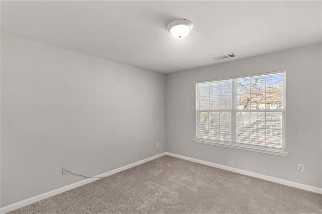 6816 Blackstone Place Mableton, GA 30126 - Photo 18 of 33 an empty room with a window