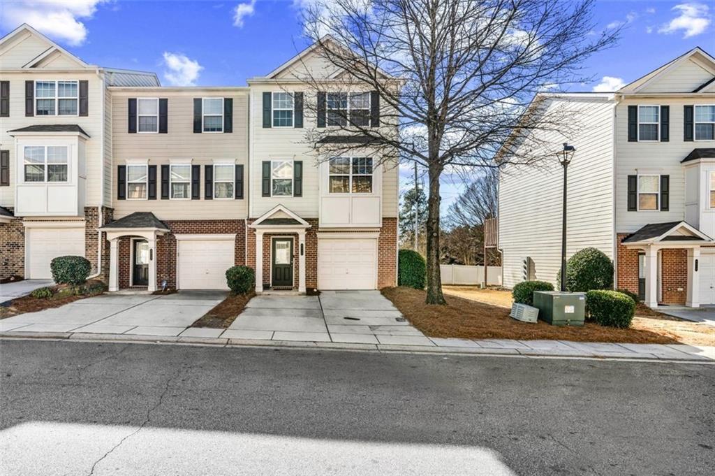 6816 Blackstone Place Mableton, GA 30126 - Photo 2 of 33 a front view of a residential houses with yard