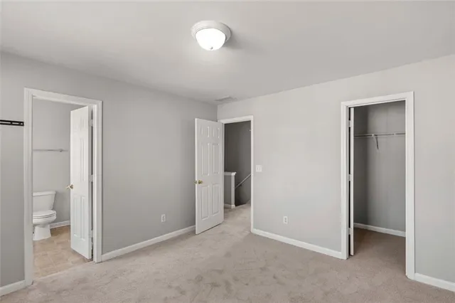 a view of an empty room and a room