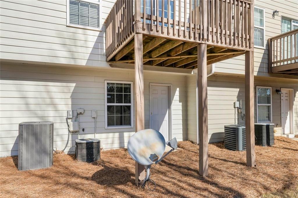 6816 Blackstone Place Mableton, GA 30126 - Photo 31 of 33 a view of a patio with table and chairs and wooden floor