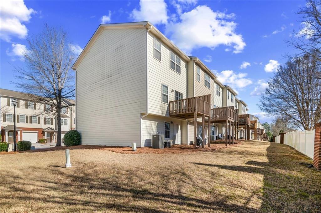 6816 Blackstone Place Mableton, GA 30126 - Photo 33 of 33 a front view of a building with a road
