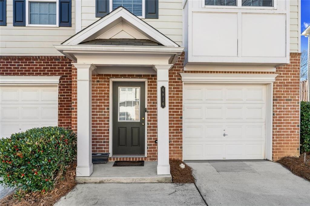 6816 Blackstone Place Mableton, GA 30126 - Photo 6 of 33 a view of a house with a door and a wooden bench