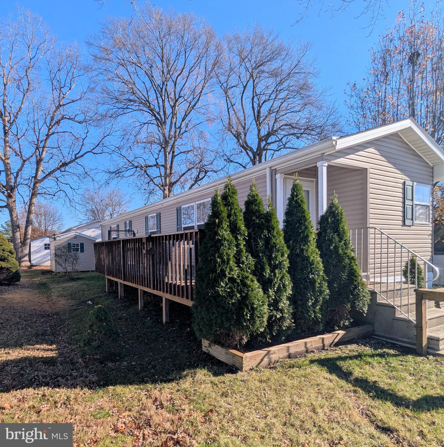 107 Trailway Road Middle River, MD 21220 - Photo 4 of 29 Charming home with lush greenery and sunlight.