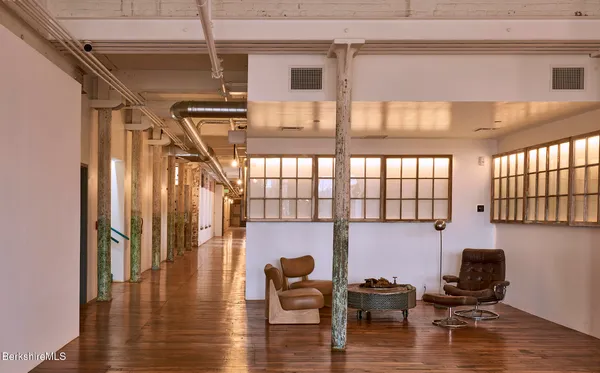 a hallway with wooden floor