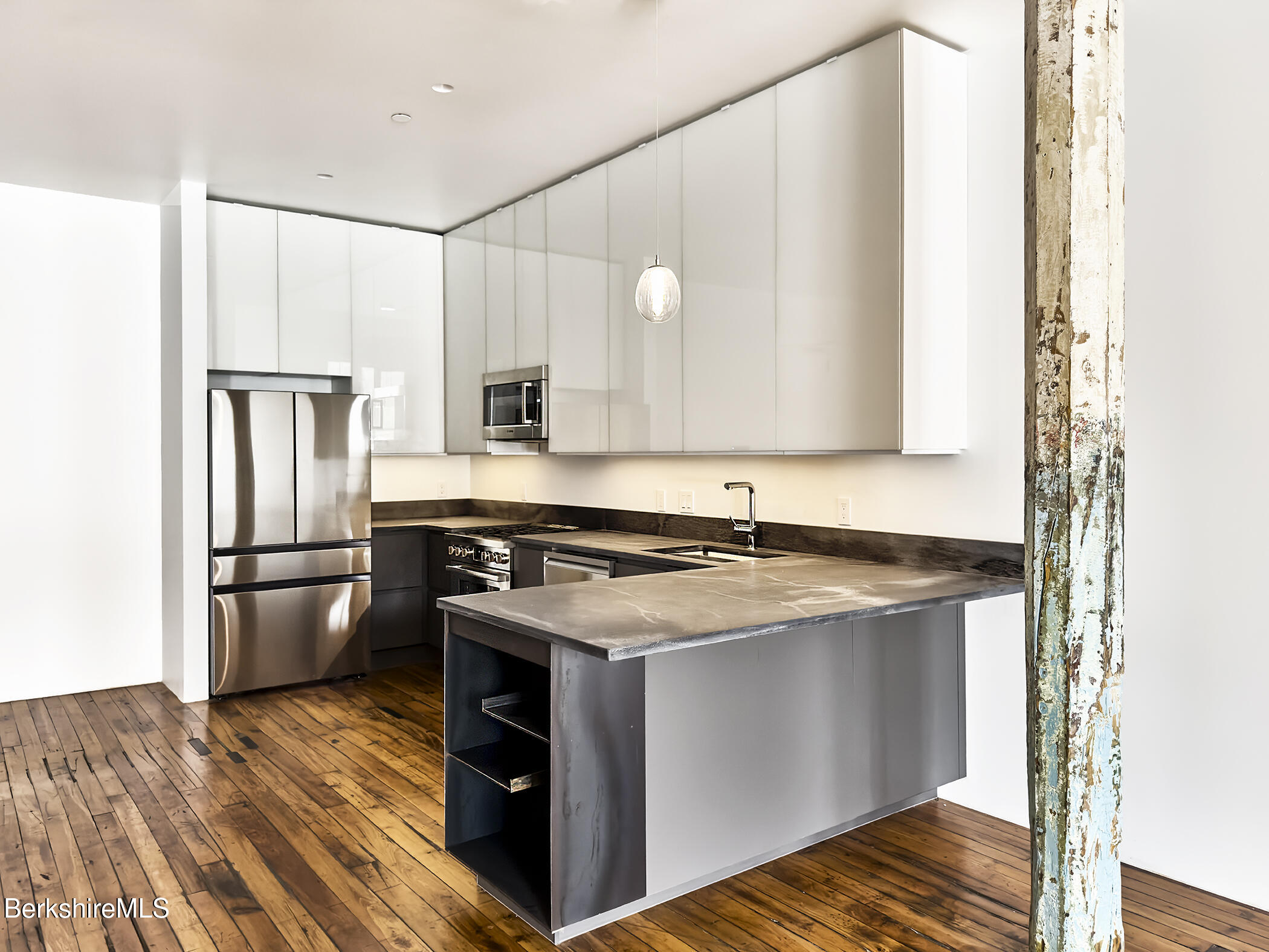 520 State Road, Unit 203 North Adams, MA 01247 - Photo 6 of 17 a kitchen with a stove sink and refrigerator