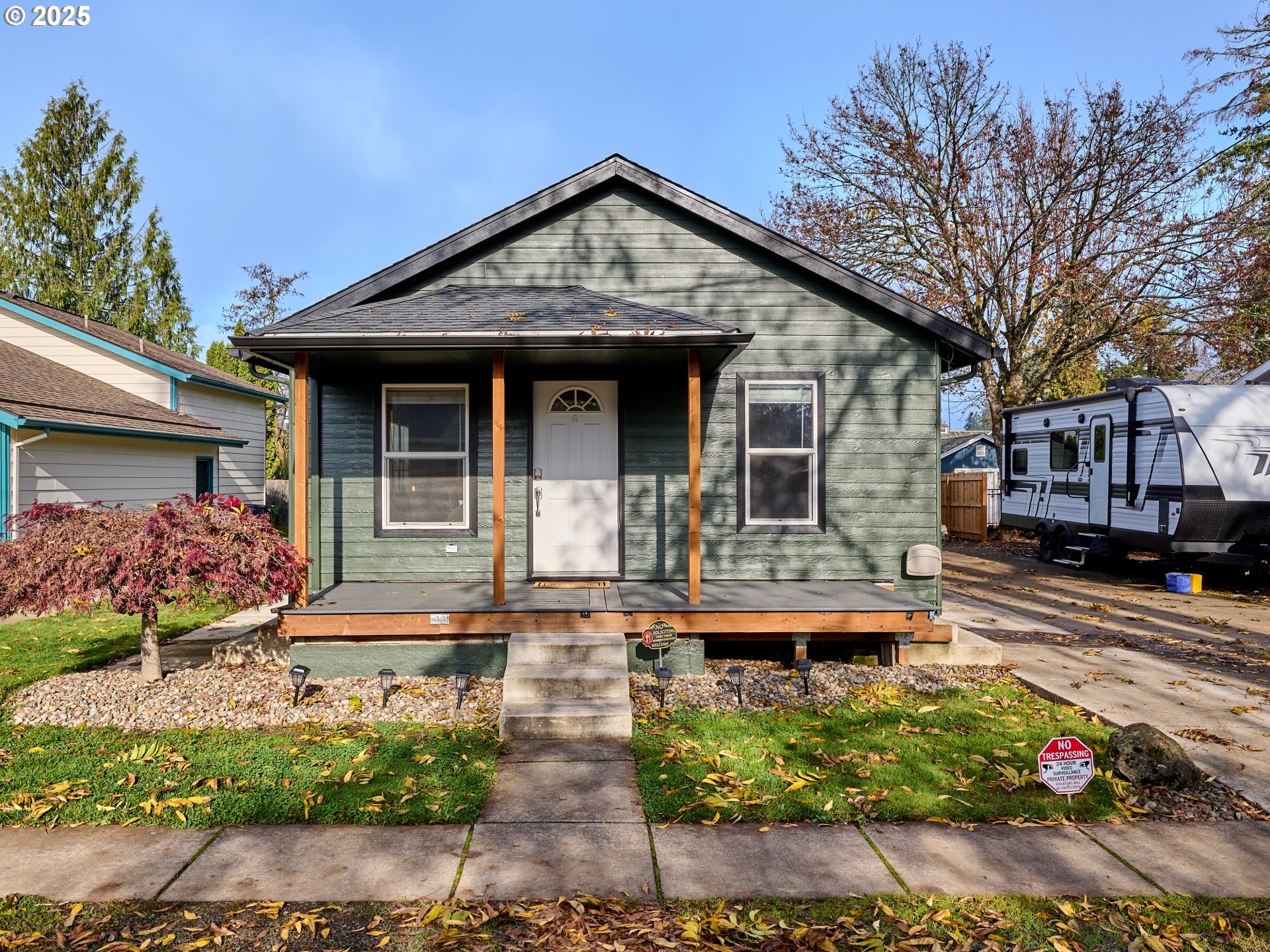 a front view of a house with garden