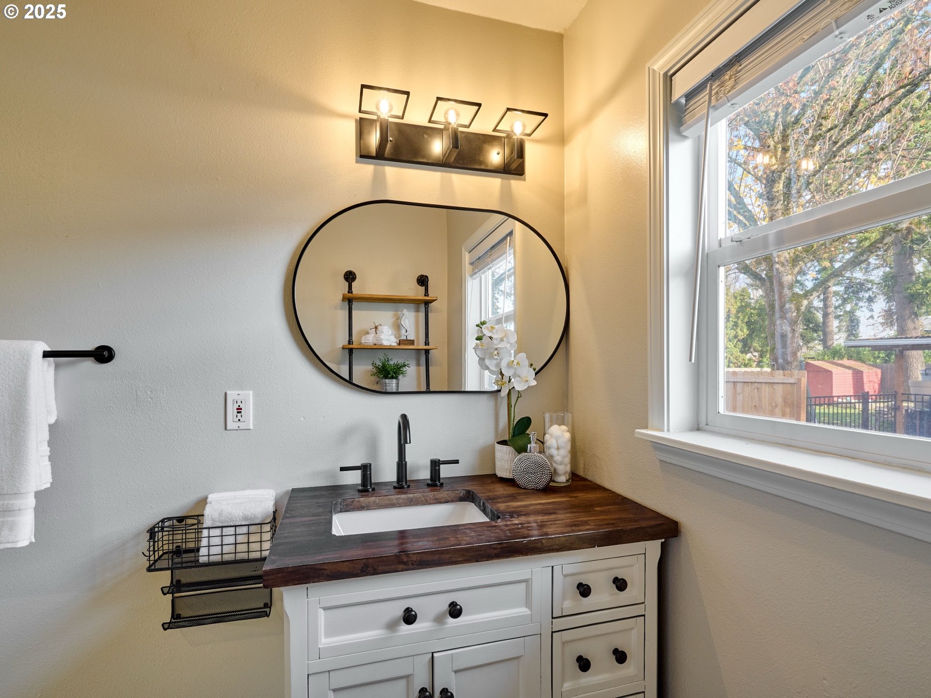 1006 Well Street Silverton, OR 97381 - Photo 14 of 35 a bathroom with a granite countertop sink and a mirror