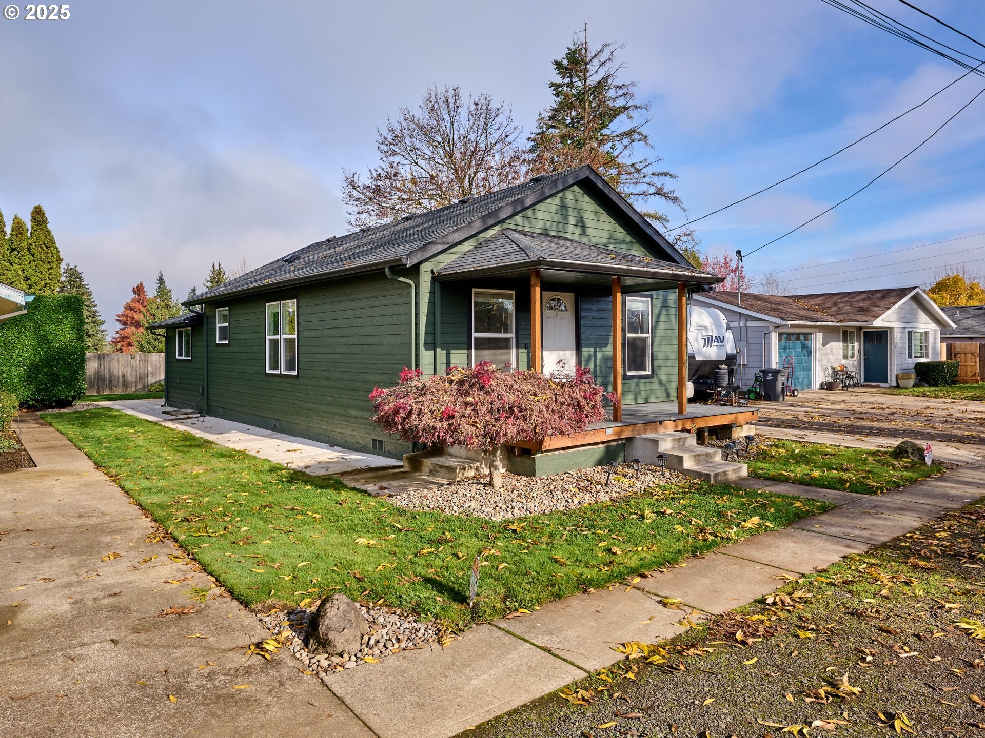 1006 Well Street Silverton, OR 97381 - Photo 2 of 35 a front view of a house with garden