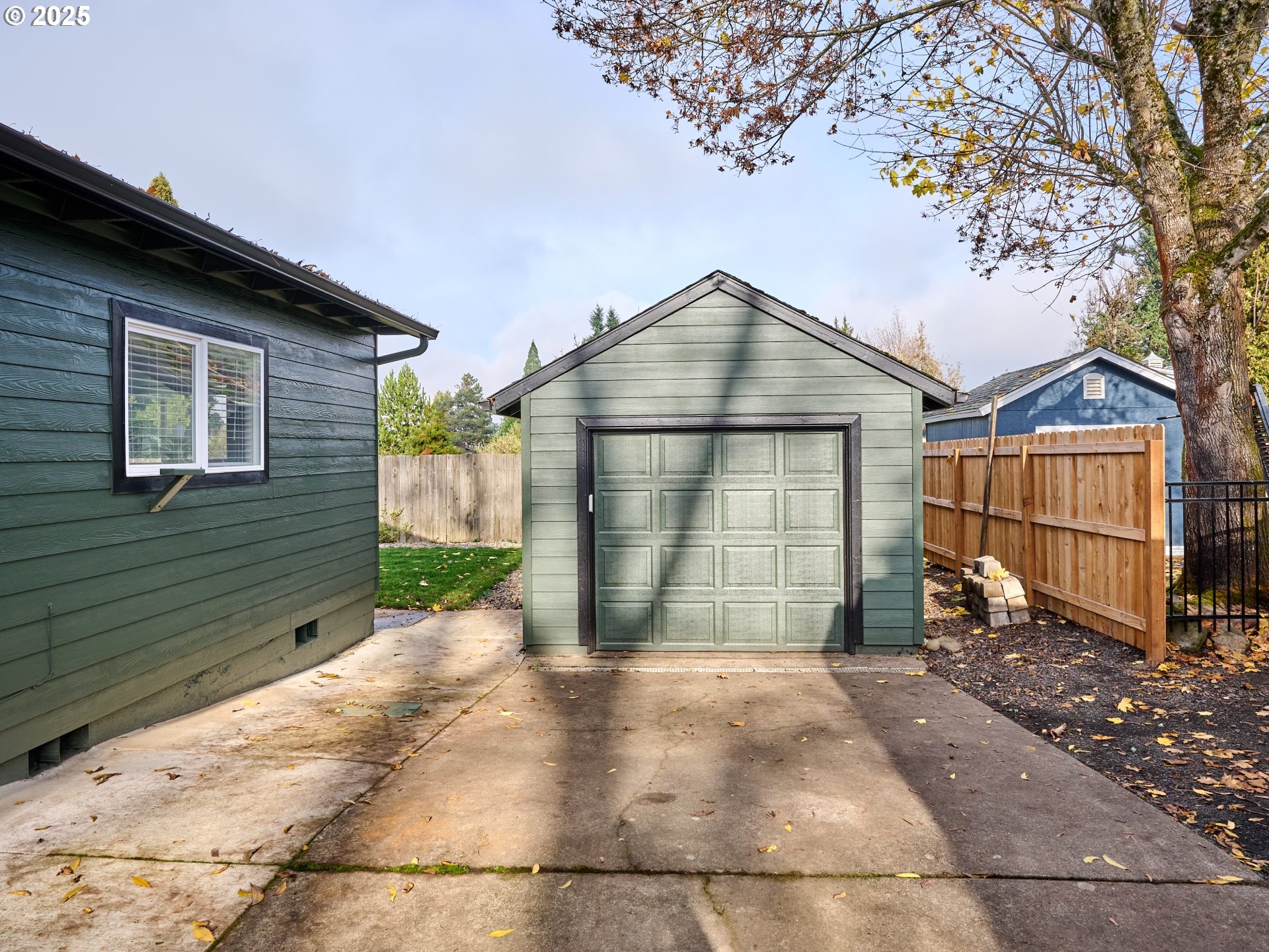 1006 Well Street Silverton, OR 97381 - Photo 27 of 35 a front view of a house with a yard and garage