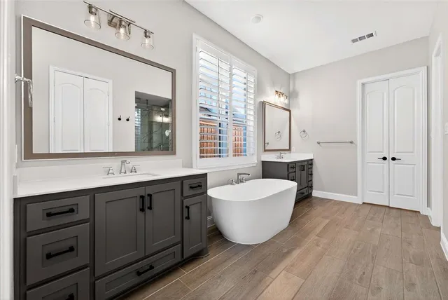 a bathroom with a glass shower door