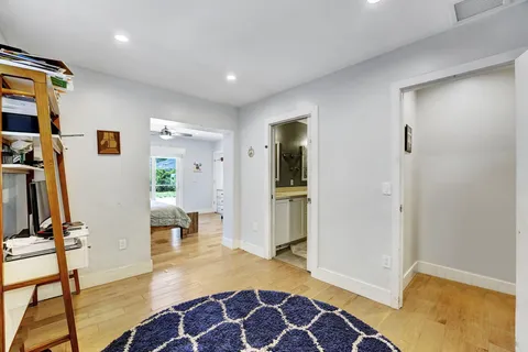 a view of a livingroom with furniture and front door