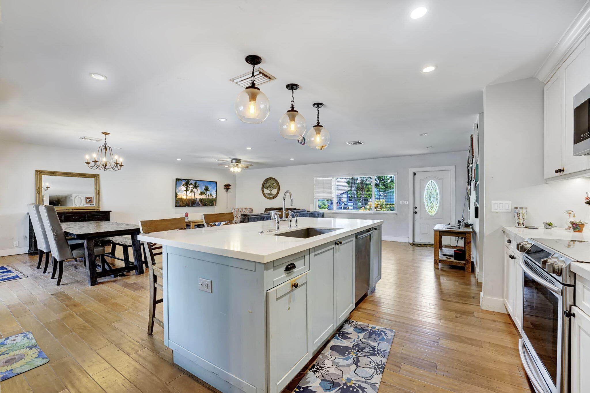 1260 Southwest 17th Street Boca Raton, FL 33486 - Photo 6 of 23 a kitchen with a stove and wooden floor