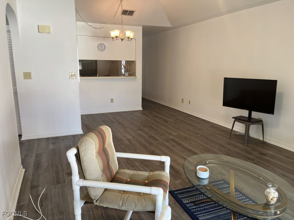 11500 Caravel Circle, Unit 4028 Fort Myers, FL 33908 - Photo 12 of 34 a living room with furniture and a flat screen tv
