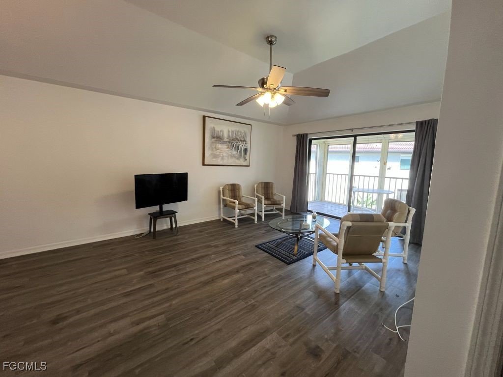 11500 Caravel Circle, Unit 4028 Fort Myers, FL 33908 - Photo 13 of 34 a living room with furniture a flat screen tv and a window