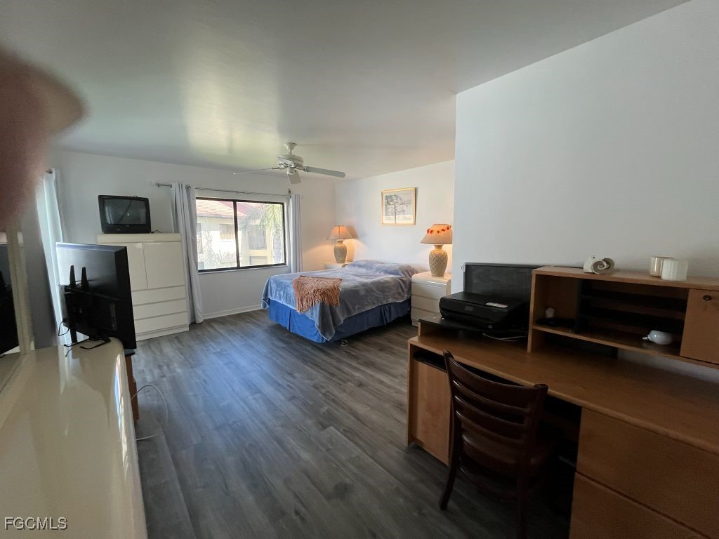 11500 Caravel Circle, Unit 4028 Fort Myers, FL 33908 - Photo 15 of 34 a bedroom with two beds and a couch