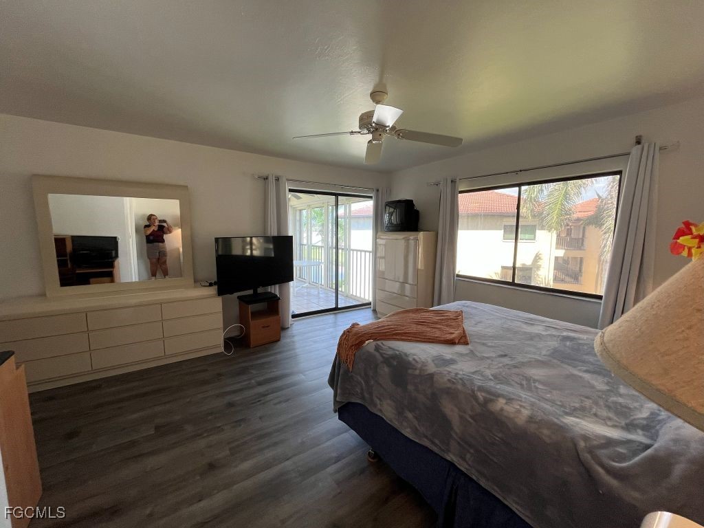 11500 Caravel Circle, Unit 4028 Fort Myers, FL 33908 - Photo 16 of 34 a bed room with a bed and a television