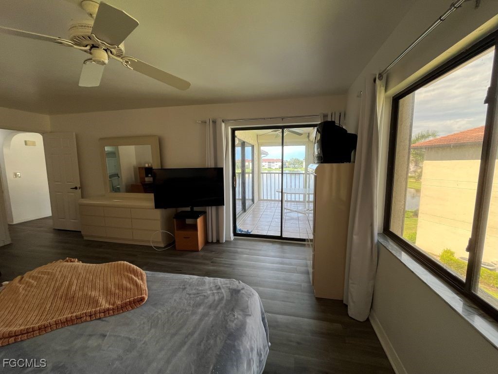 11500 Caravel Circle, Unit 4028 Fort Myers, FL 33908 - Photo 18 of 34 a living room with furniture and a flat screen tv