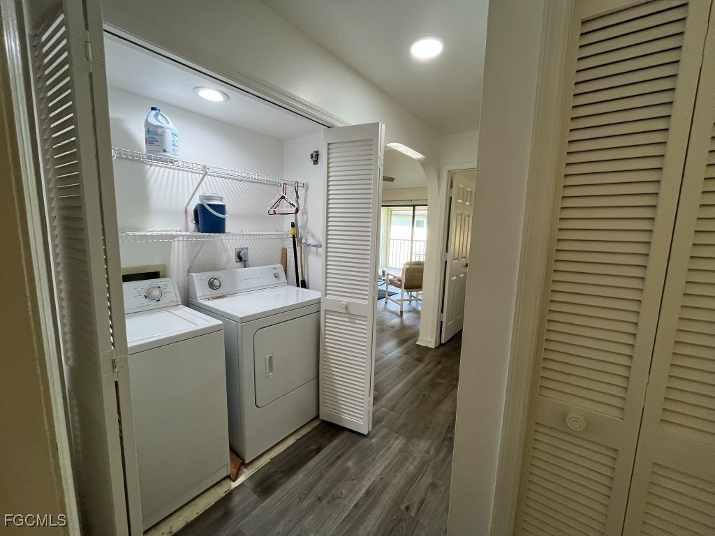 11500 Caravel Circle, Unit 4028 Fort Myers, FL 33908 - Photo 22 of 34 a view of a hallway with bathroom and wooden floor