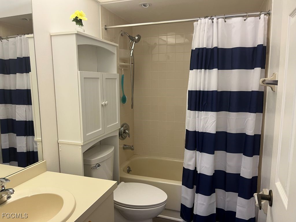 11500 Caravel Circle, Unit 4028 Fort Myers, FL 33908 - Photo 24 of 34 a bathroom with a sink a toilet and shower
