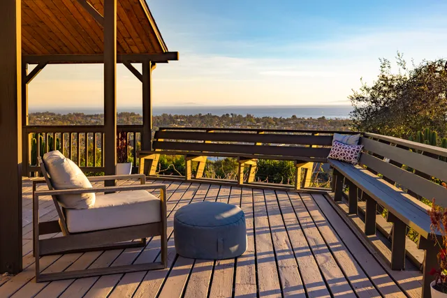 a view of a terrace with chairs and a table