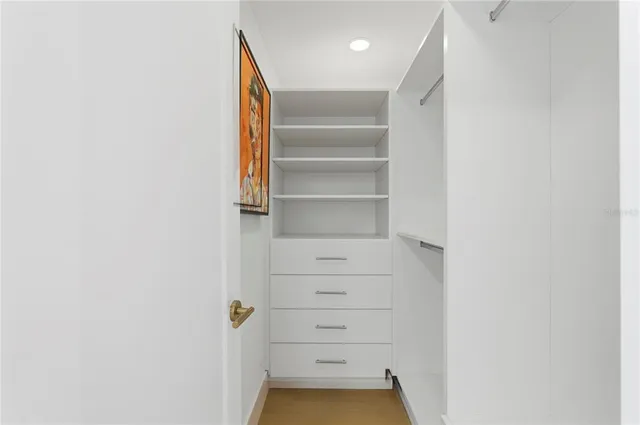 a bathroom with a double vanity sink toilet and shower