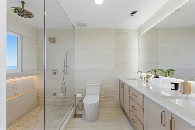 a bathroom with double sink and a mirror