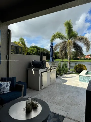a terrace with outdoor seating and city view